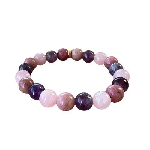 Rhodochrosite bracelet promoting emotional healing and self-love.