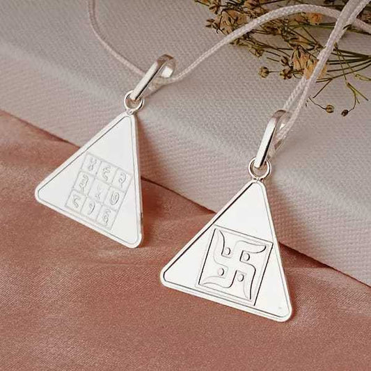 Triangular Pyra Yantra pendants for positive energy and well-being.
