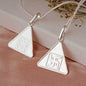 Triangular Pyra Yantra pendants for positive energy and well-being.