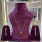 Aurya Lux Silver Set displayed on a purple stand with necklace and earrings.