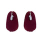 The Rosavelle Drop Silver Earrings on burgundy display.