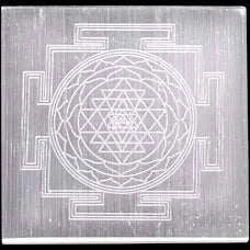 Selenite plate with intricate geometric design.