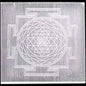 Selenite plate with intricate geometric design.